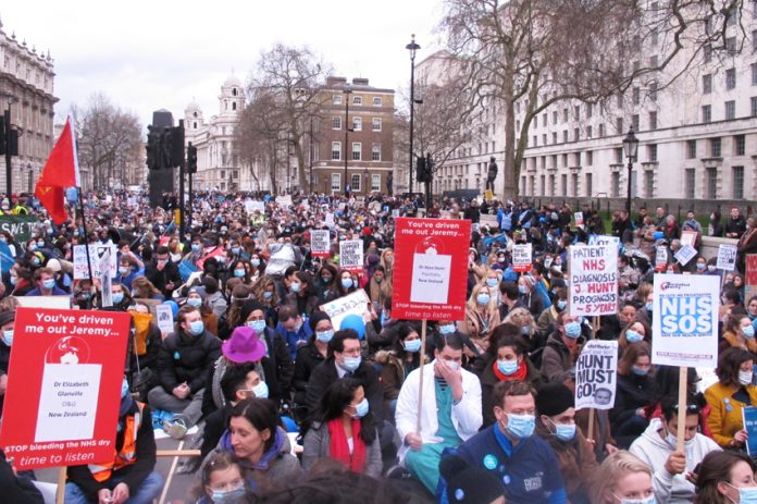 Junior doctors in a mass sit-down protest outside Downing Street in 2016. Hunt’s imposed contract is now up for renegotiation