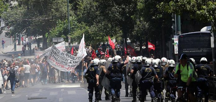 Riot police attack demonstrators on Wednesday in Athens. Photo credit: Marios Lolos