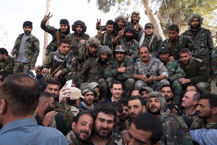 Syrian President ASSAD (centre) with Syrian troops after they liberated the region from Islamist terrorists