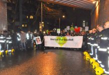 Grenfell firefighters form a Guard of Honour for the silent march – the community supports them 100 per cent