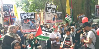 An enthusiastic crowd gathers at the start of yesterday’s Al Quds march outside the Saudi Embassy in central London