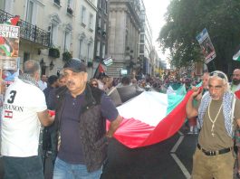 ‘Every square inch of Palestine must be liberated!’ The march sets off, lead by a huge Palestinian flag, from outside the Saudi embassy in central London