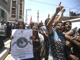 Palestinians on the funeral march of Palestinian paramedic Razan Ashraf al-Najjar killed by Israeli forces on the Gaza-Israel border