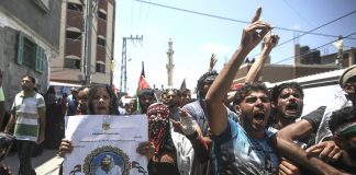 Palestinians on the funeral march of Palestinian paramedic Razan Ashraf al-Najjar killed by Israeli forces on the Gaza-Israel border