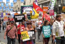 Workers and young people march on a Tories Out! demonstration last year