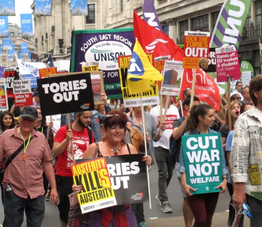 Workers and young people march on a Tories Out! demonstration last year