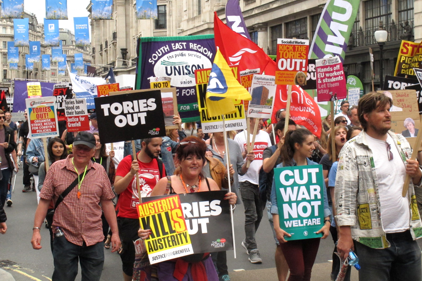 Workers and young people march on a Tories Out! demonstration last year