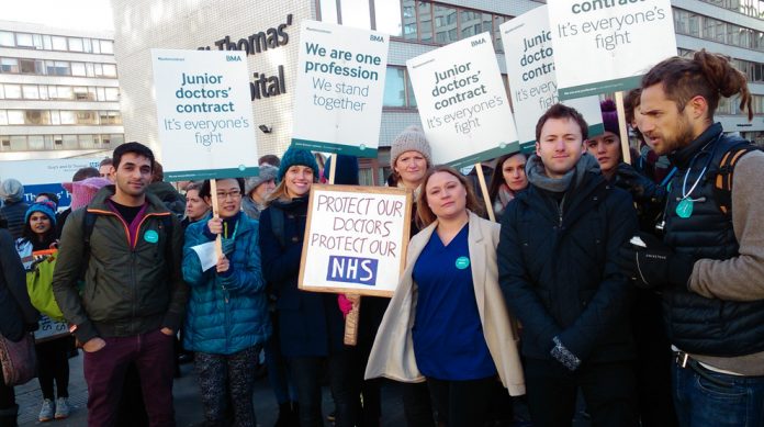 Junior doctors on the picket line during their strike in 2015 – they are often exhausted says the General Medical Council (GMC)