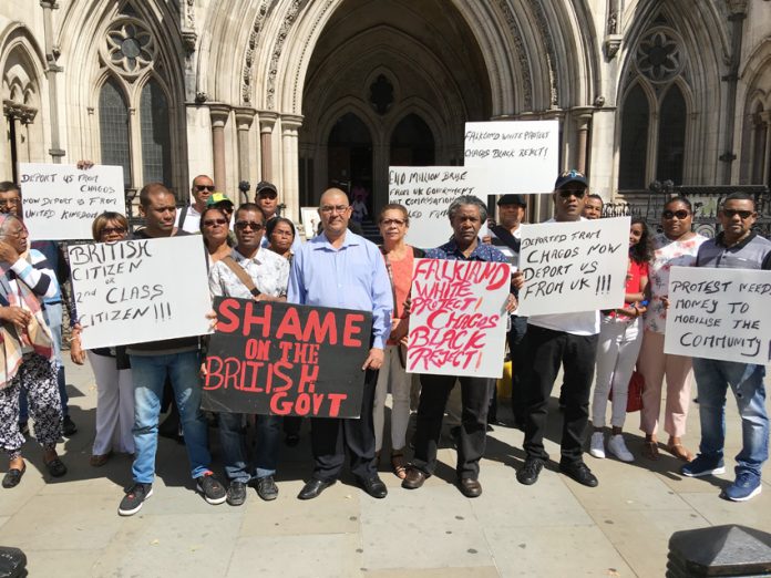 Chagos Islanders supporting DOMINIQUE ELYSSE (centre, wearing a light shirt) outside the High Court in London yesterday morning