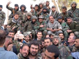 Syrian President BASHAR AL-ASSAD surrounded by Syrian troops during the liberation of Ghouta