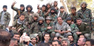 Syrian President BASHAR AL-ASSAD surrounded by Syrian troops during the liberation of Ghouta