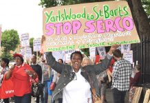 Protester demands the Seco-run Yarl’s Wood detention centre is shut down – Serco are now evicting hundreds of asylum seekers