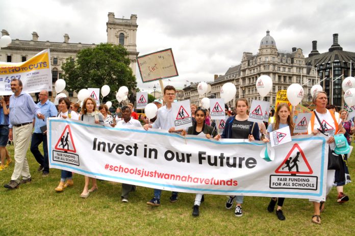 Teachers march to Parliament demanding an increase to education funding
