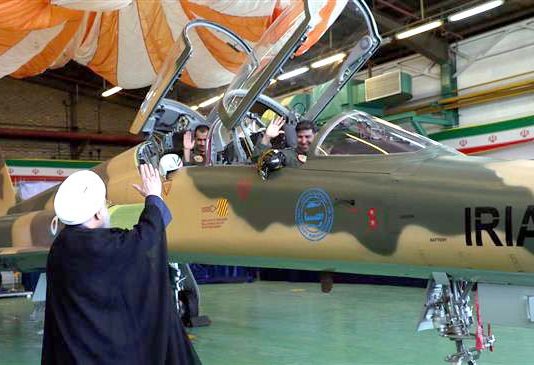 Iranian President HASSAN ROUHANI waves to pilots at the launch of the Kowsar fighter jet