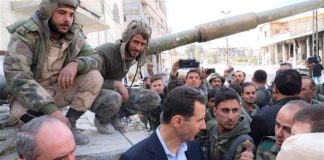 Syrian president BASHAR AL-ASSAD greeted by Syrian troops after the victory in Eastern Ghouta