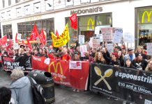 Fast food workers rallying outside McDonald’s in Leicester Square, central London yesterday demanded ‘Fair Pay Now!’