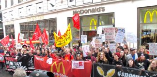 Fast food workers rallying outside McDonald’s in Leicester Square, central London yesterday demanded ‘Fair Pay Now!’