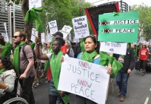 Local residents join forces with firefighters to demand ‘No Justice No Peace’ on a march last June – the North Kensington Law Centre claims that Grenfell survivors are being pressurised into accepting sub-standard housing, 150 families are still without h