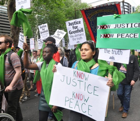 Local residents join forces with firefighters to demand ‘No Justice No Peace’ on a march last June – the North Kensington Law Centre claims that Grenfell survivors are being pressurised into accepting sub-standard housing, 150 families are still without h