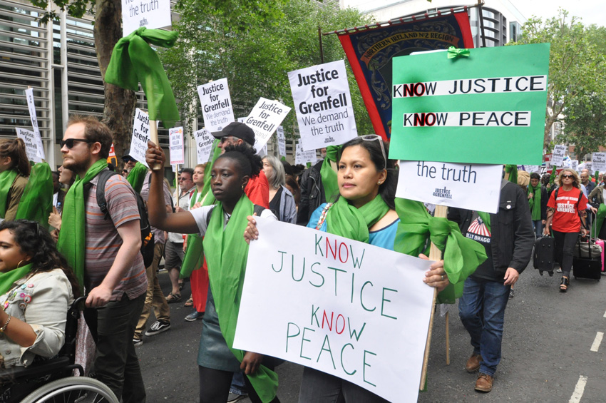 Local residents join forces with firefighters to demand ‘No Justice No Peace’ on a march last June – the North Kensington Law Centre claims that Grenfell survivors are being pressurised into accepting sub-standard housing, 150 families are still without h
