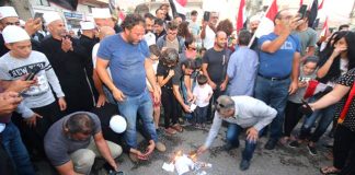 Syrians in the occupied Golan Heights burn ballot papers declaring the election void due to the Israelis illegal occupation