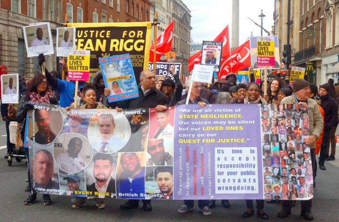 The front banner on the United Families and Friends Campaign march demanding justice for those who have died at the hands of the state