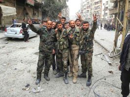 Three children killed in US-led bombing of Deir Ezzor Syrian troops celebrate a victory against terrorist forces