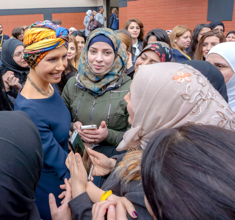 ASMA AL-ASSAD, wife of Syrian President Bashar al-Assad, is warmly greeted by lecturers and graduated Master students of Language and Speech at the event  of cooperation between AAMAL and Damascus University