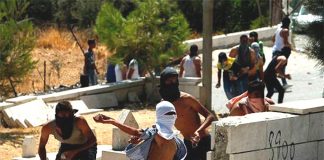 Palestinian youth confront Israeli troops in the West Bank