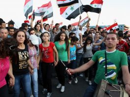 Syrian youth on a demonstration in support of President Assad – Syria supports the government of President Maduro in Venezuela