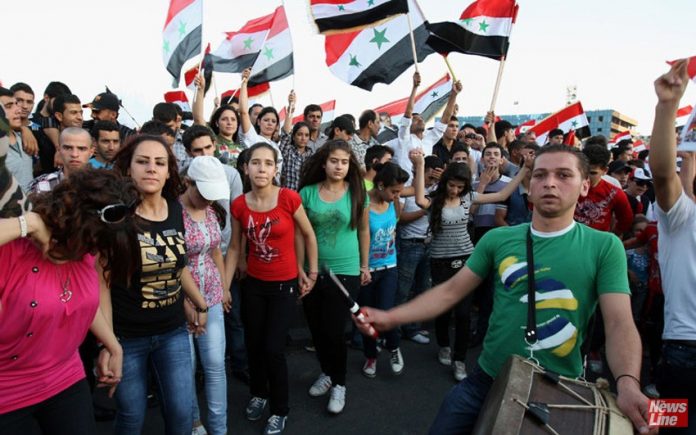 Syrian youth on a demonstration in support of President Assad – Syria supports the government of President Maduro in Venezuela
