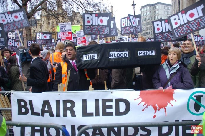 British demonstrators condemn Tony Blair outside the Chilcot Inquiry in 2010