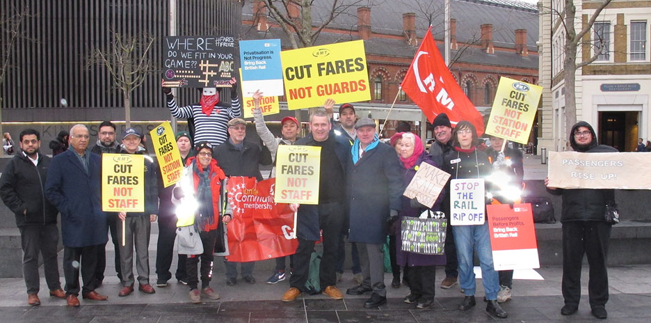 Rail passengers joined forces with RMT train workers yesterday morning outside King’s Cross station, London, England demanding ‘cut fares, not staff’
