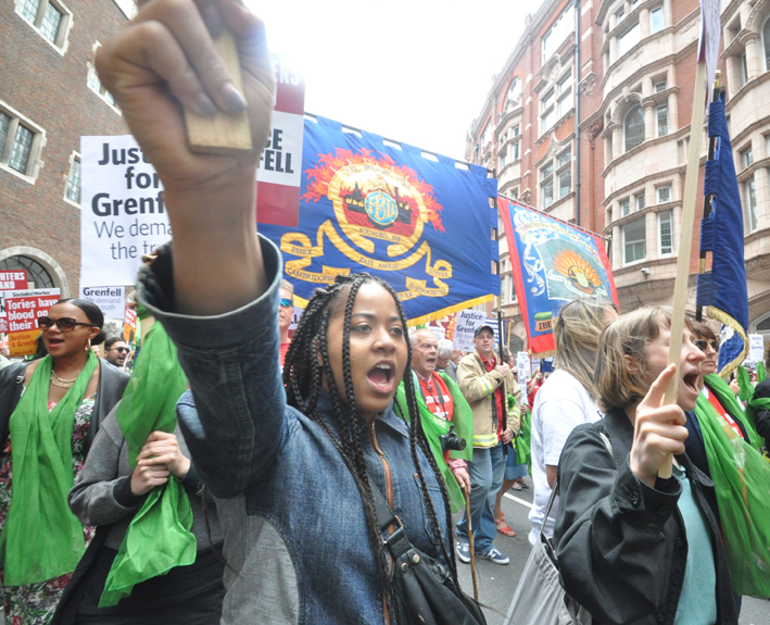 Young protester demanding justice for Grenfell on the FBU-Grenfell march on the first anniversary of the inferno